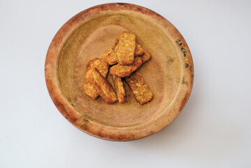 Delicious fried tempeh or fried tempeh is ready to eat, with a white background.