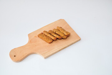 Delicious fried tempeh or fried tempeh is ready to eat, with a white background.