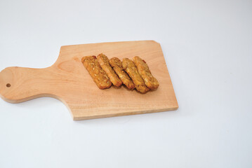 Delicious fried tempeh or fried tempeh is ready to eat, with a white background.