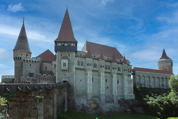 Fototapeta premium Romania Corvin Castle on a cloudy summer day