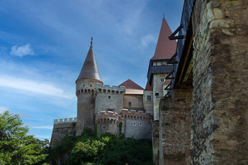 Fototapeta premium Romania Corvin Castle on a cloudy summer day