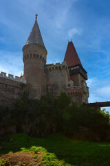 Fototapeta premium Romania Corvin Castle on a cloudy summer day