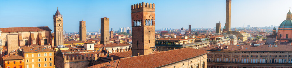 Aerial panoramic view of Piazza Maggiore in Bologna old town, Emilia Romagna, Italy, with historic architecture, Palazzo del Podesta and towers at sunrise. Italian cityscape. Travel destination © samael334
