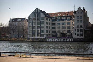 Squatted buildings along the Spree River in Berlin, showcasing urban decay and alternative culture