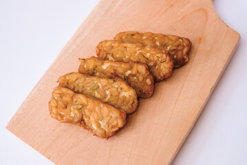 Delicious fried tempeh or fried tempeh is ready to eat, with a white background.