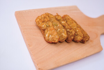 Delicious fried tempeh or fried tempeh is ready to eat, with a white background.