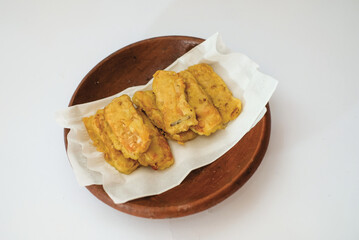 Delicious fried tempeh or fried tempeh is ready to eat, with a white background.