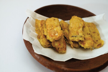 Delicious fried tempeh or fried tempeh is ready to eat, with a white background.