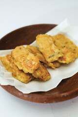 Delicious fried tempeh or fried tempeh is ready to eat, with a white background.