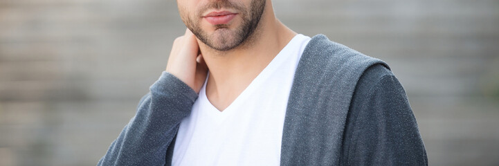 Obraz premium Cropped view of man outdoor. Unshaven man portrait. Casual style of man. Guy has unshaven beard. Man with cropped view. Casual male style. Skin skincare