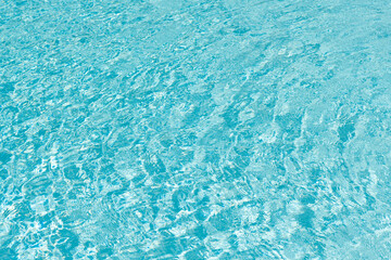 Swimming pool rippled. Summer vacation. Spa resort on summer vacation. Pool side resort with pool water surface background. Sea ripples on blue pool background. Sea background. Holiday getaway