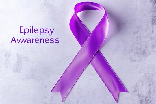 Purple ribbon for epilepsy awareness on a light background
