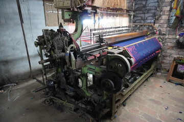 power loom, a mechanized weaving device crucial to the Industrial Revolution that automates fabric...