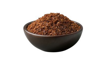 A mound of seasoning sits in a dark bowl, showcasing a rich blend of spices with a vibrant, granular texture.