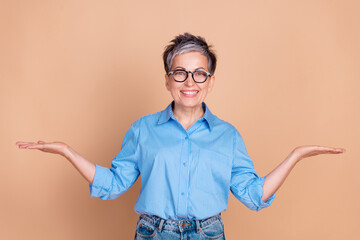 Photo of senior business lady wearing blue shirt holding two hands balance between vacancies...
