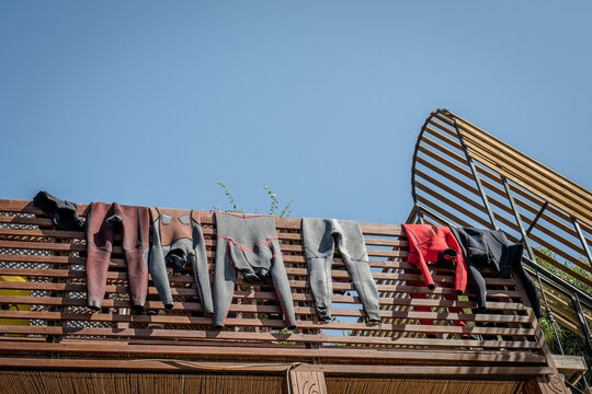 Wetsuits hung out to dry