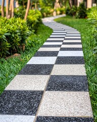 Serpentine Pathway of Black and White Tiles Through Lush Greenery in a Tranquil Outdoor Garden Space for Relaxation and Reflection