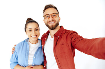 Attractive smiling arabian man and woman taking a selfie, looking happy and cheerful, casually dressed, stand on isolated white background, looking at camera