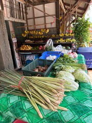 A colorful bunch of fresh vegetables are sitting on top of a green table