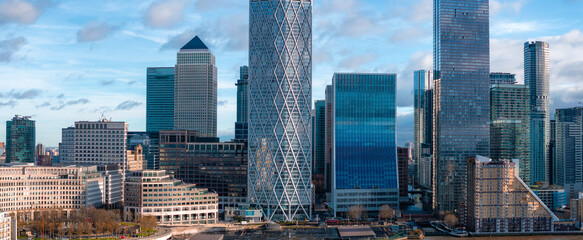 The image captures the modern skyscrapers of Canary Wharf, London, with One Canada Square at the...