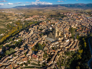 Aerial view of Segovia city. View of Cathedral of Segovia. Sunset point, warms colours on the cathedral building. Famous travel destination in Spain. Medieval city.