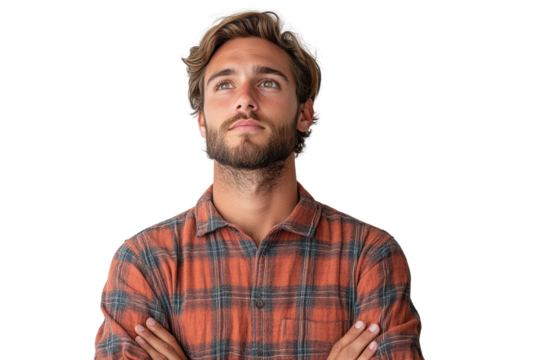 A young man with a stylish beard and tousled hair, wearing a checkered shirt, looking upwards thoughtfully against a white isolated background.