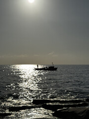 silhouette of a ship at sea sunset. High quality photo