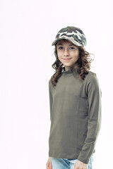 Smiling girl wearing camouflage cap and casual clothes