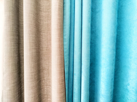 Elegant fabric curtains in shades of beige and turquoise creating a modern aesthetic for interior design spaces