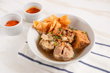 Bakso Arema, Meatballs Food Special from Malang East Java Indonesia. Close Up. Served with Soy Sauce, Sauce, and Chilli Paste