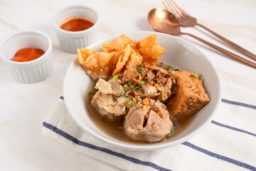 Bakso Arema, Meatballs Food Special from Malang East Java Indonesia. Close Up. Served with Soy Sauce, Sauce, and Chilli Paste