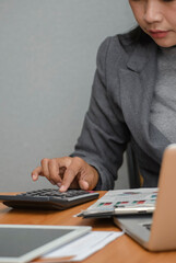 Business and Financial Planning Concept. Financial advisor plan, use calculator to calculate...