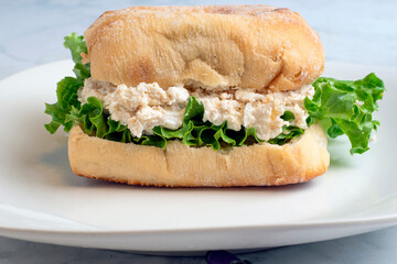chicken salad sandwich  with a pickle