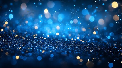 A blue and gold bokeh background with small round lights scattered across it.