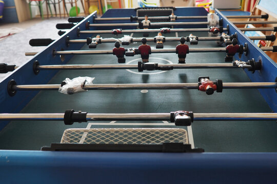Table football, we see individual players on poles.