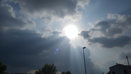 A dramatic weather transition: heavy rain turning into soft snowfall, with clouds parting to reveal the sun peeking through