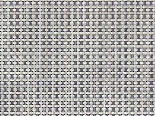 Close up photo of light grey woven bamboo rattan texture. Wicker art or rattan weaving art pattern in random small checkerboard shapes. Seamless background texture.