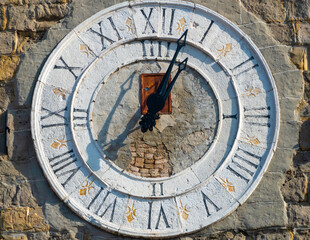 Closeup of the ancient clock on the bell tower of the Koper cathedral, Koper, Slovene Riviera, Slovenia