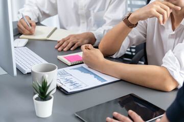 Data analysts team of office worker collaborate on business intelligence BI dashboard to analyze financial, trend, and marketing data. BI software utilization drive business success. Prudent