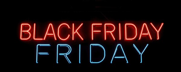 Neon sign advertises Black Friday sale. Bright red, blue neon lights spell out Black Friday on dark background. Commercial message for huge discounts. Festive, modern style. Retail atmosphere. Great