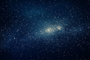 Fototapeta premium A stunning view of a starry galaxy with glowing golden light stretching across a deep blue sky 