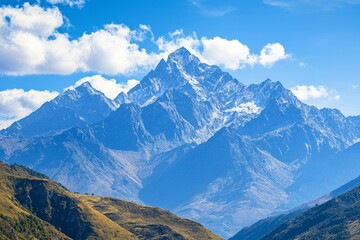 Majestic mountain range with a clear blue sky, clouds hovering over peaks, untouched by civilization, environmental purity, highly detailed landscape photography