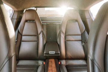 rear seats upholstered in black leather in the car