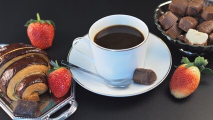 Breakfast bursts with fresh strawberries adding vibrant touch to table featuring steaming coffee and rich chocolate pastries, blending fruity freshness with bold richness of coffee and chocolate