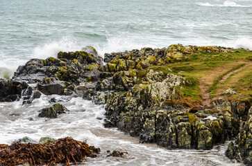 Waves crashing over the rocks at Groomsport Co. Down Northern Ireland