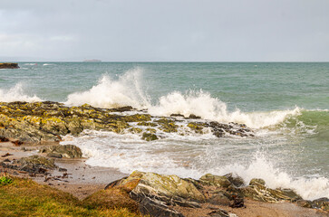 Waves crashing over the rocks at Groomsport Co. Down Northern Ireland