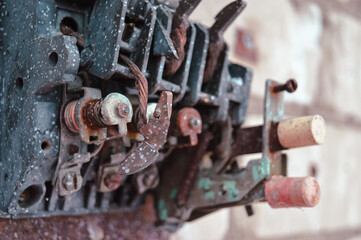 an old broken switch mechanism in which the insides with small wires, bolts and other electrically conductive filling. Old plastic copper and silver contacts. depressing post-apocalyptic View of a