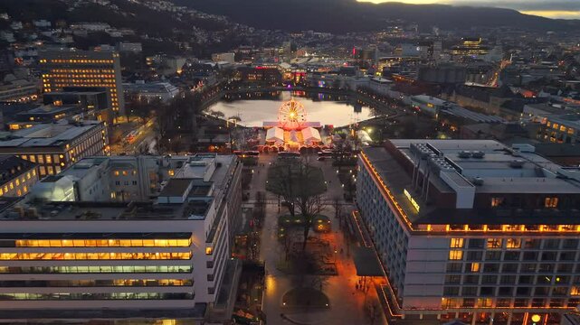 Night aerial of Bergen, Norway with Christmas market Ferris and tree