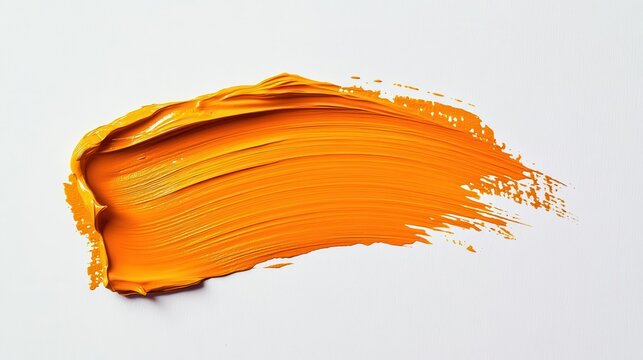 top view of an isolated orange paint brush stroke on a clean white background, showcasing texture and color in a flat lay arrangement ideal for art and design inspiration