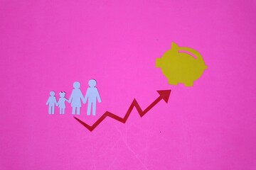 investment concept. family symbol, arrow and piggy bank image, isolated on pink background.